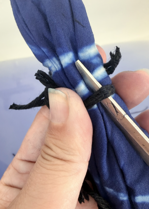 Eva Margaretha working with blue textile during her artistic research process